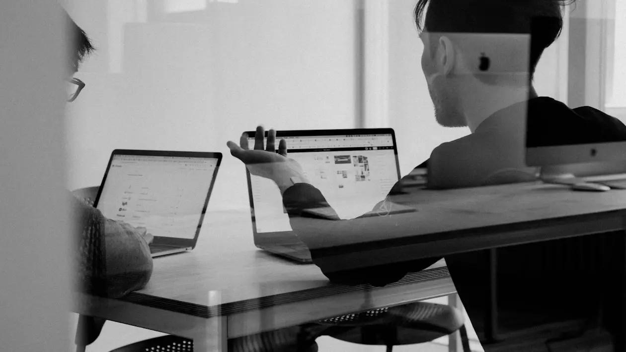 Digital strategy consultant reviewing performance data with a business owner